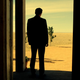 John Custer inside the symbol of civilization, staring out at the wild wastes.